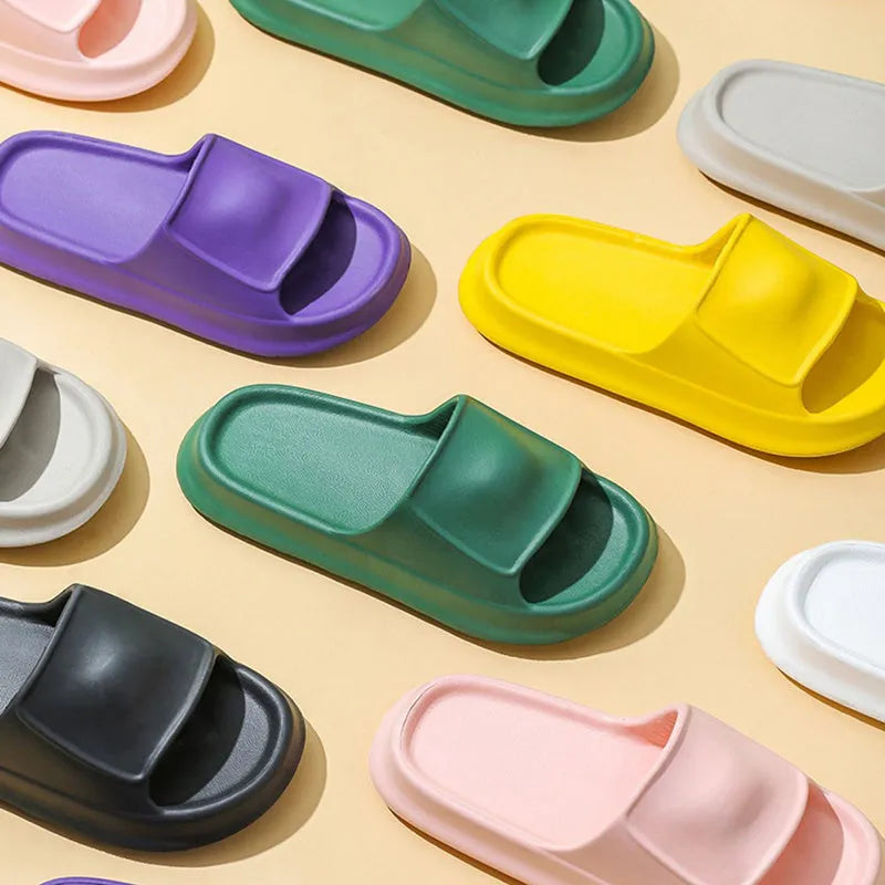 Thick-soled EVA flip flop slippers in multiple colours on a white background.