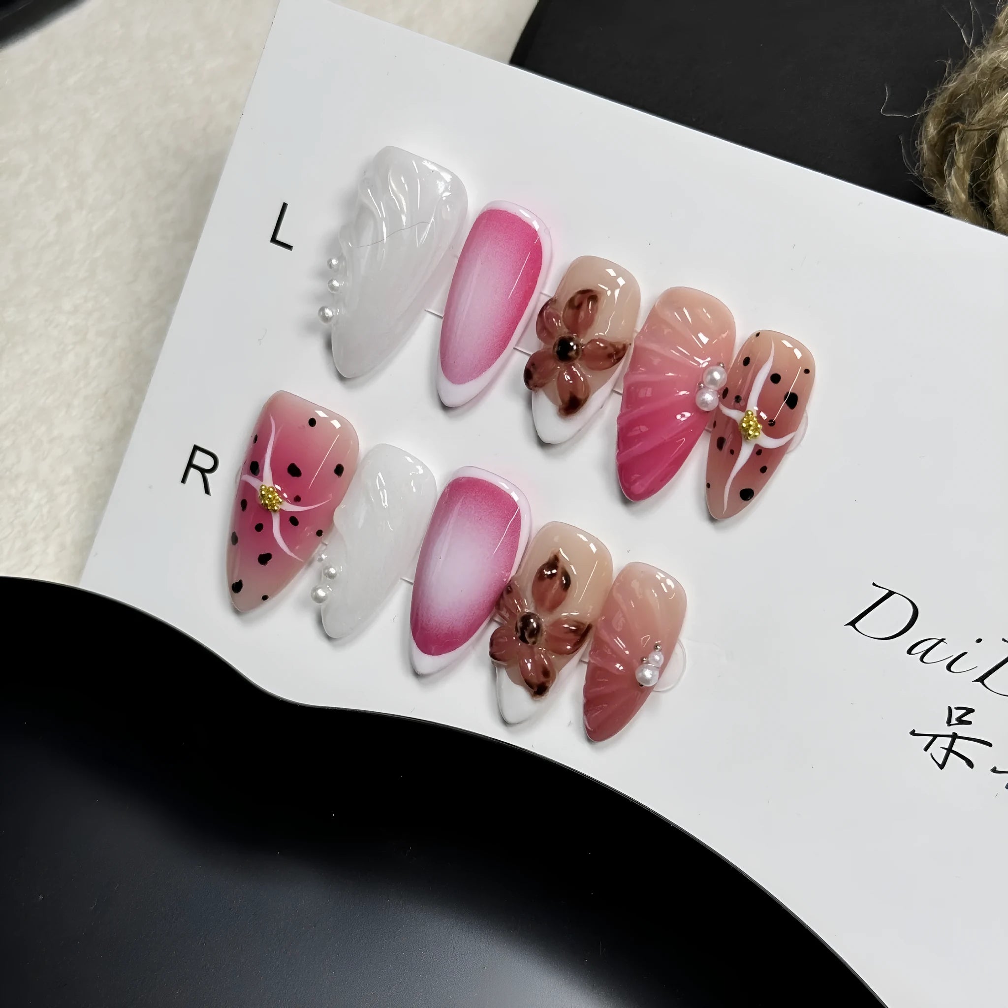 Hand-painted three-dimensional false nails with embossed carved patterns in candy colours.