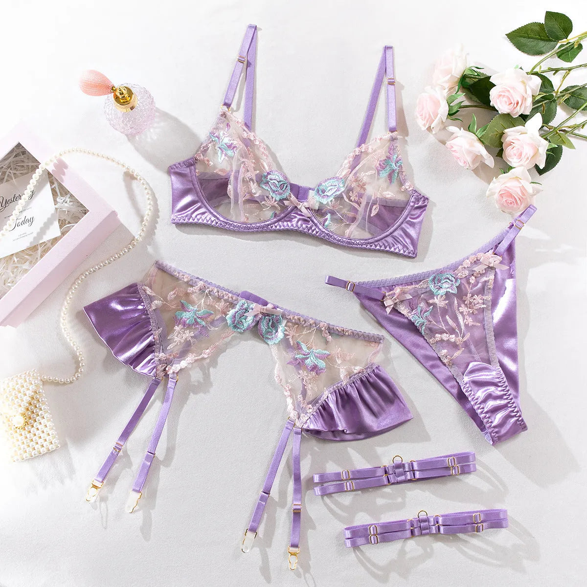 Light purple and champagne satin lingerie four-piece set showing front view