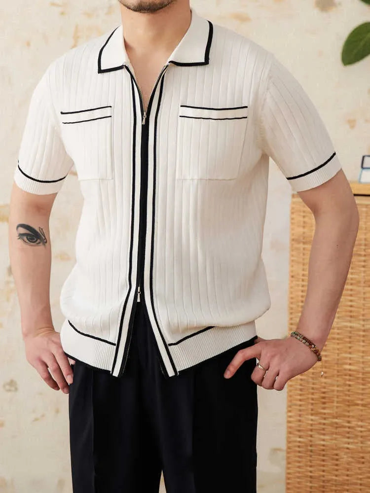 A black slim fit polo shirt with a lapel collar and short sleeves on a hanger.
