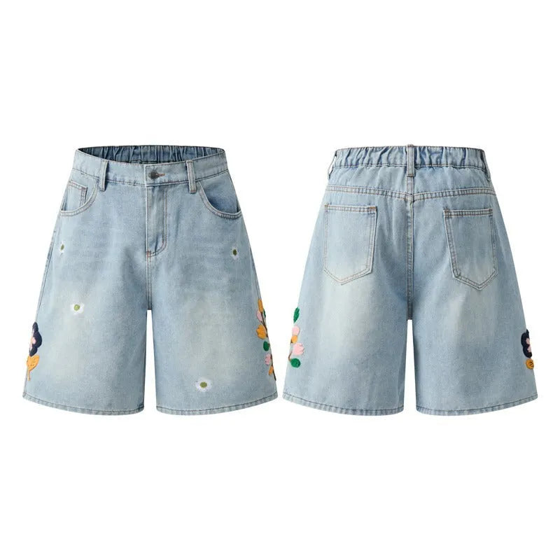 Retro loose-fit workwear shorts for men and women in washed cotton fabric with a zipper closure.