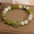 Xiuyan jade green mori-style women's bracelet with original design on a white background.