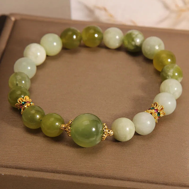 Xiuyan jade green mori-style women's bracelet with original design on a white background.