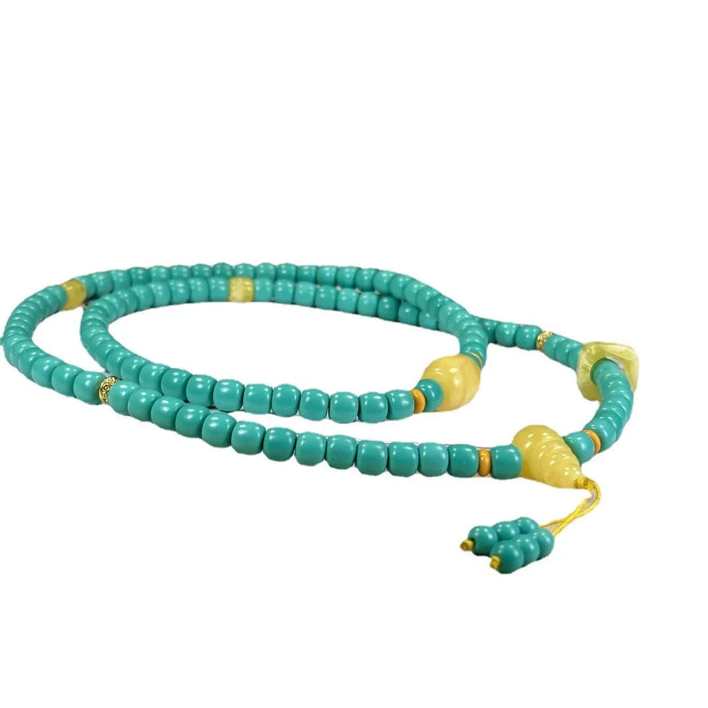 Turquoise stone lucky pendant necklace with detailed hand-woven mesh flower design on an adjustable ball bead chain.