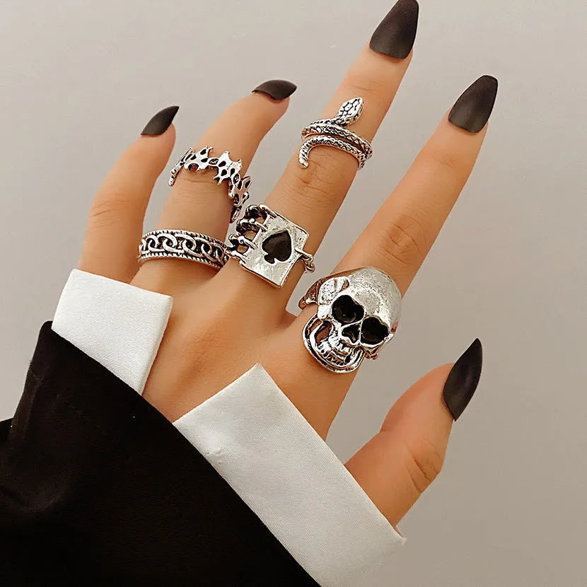 Alloy ring set with butterfly and snake retro geometric designs on display
