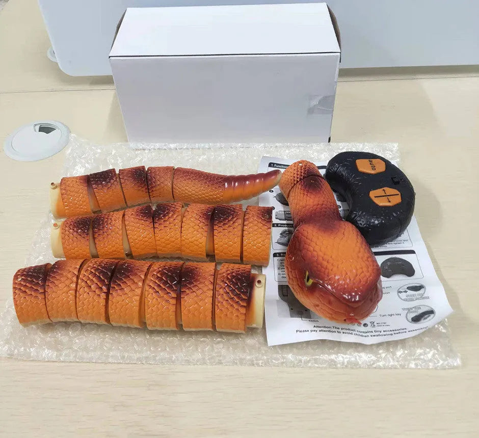 Smart sensing interactive snake cat toy with segmented plastic body and USB charging
