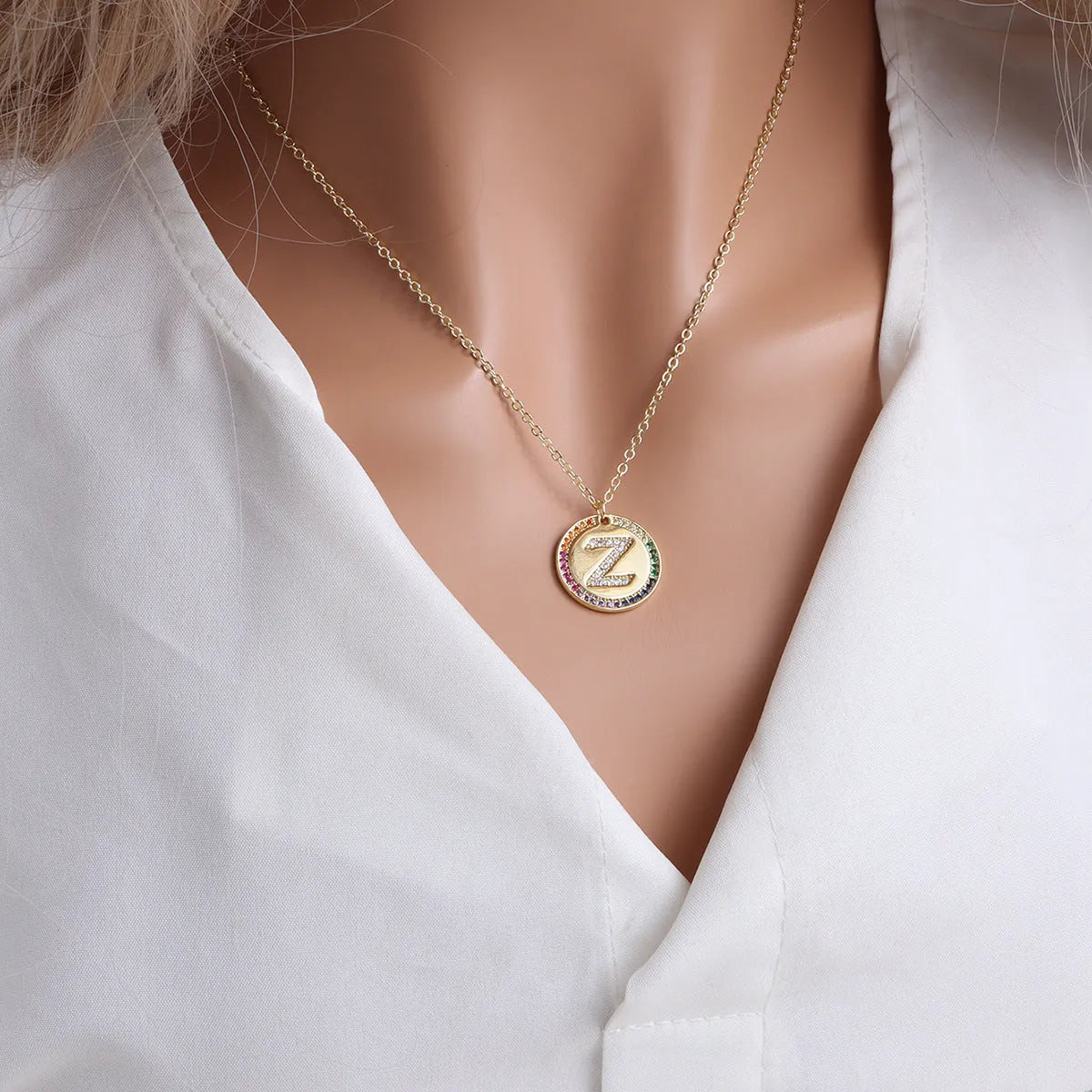 Gold English letter round pendant necklace with colourful crystals on clavicle length chain