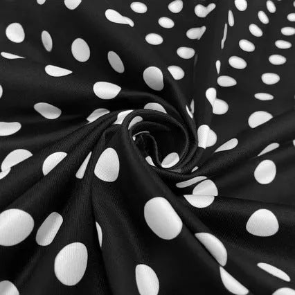 Multicolour polka dot dress with square collar, short sleeves, front zipper, and pleated midi skirt on a hanger.