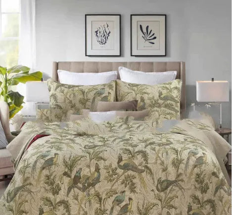 Blue American floral and bird pattern quilted cotton bedspread set on a double bed