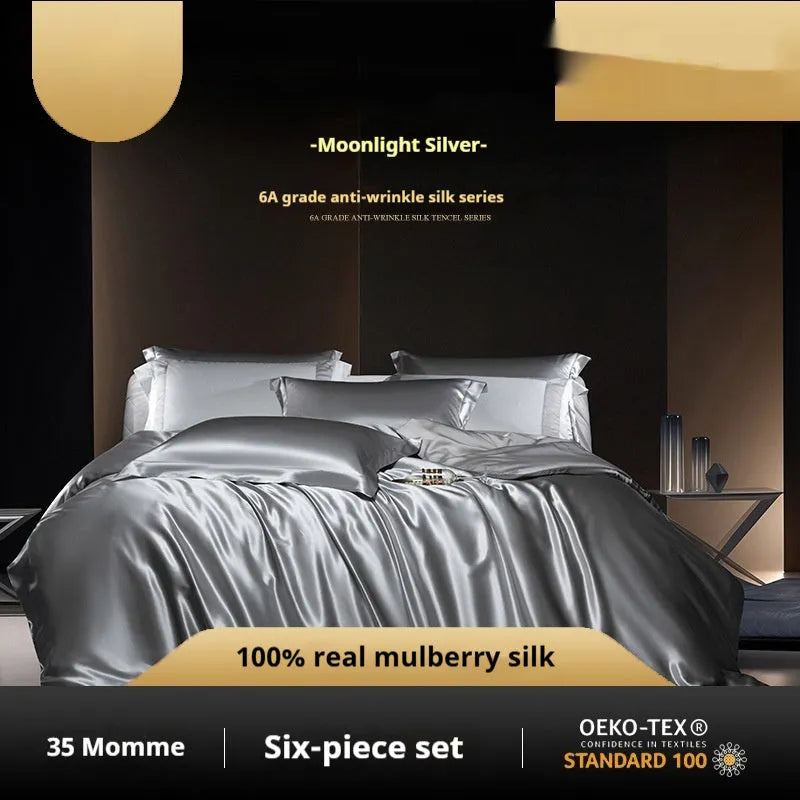 Silk four-piece bed set in a solid colour showing duvet cover and matching pillowcases.