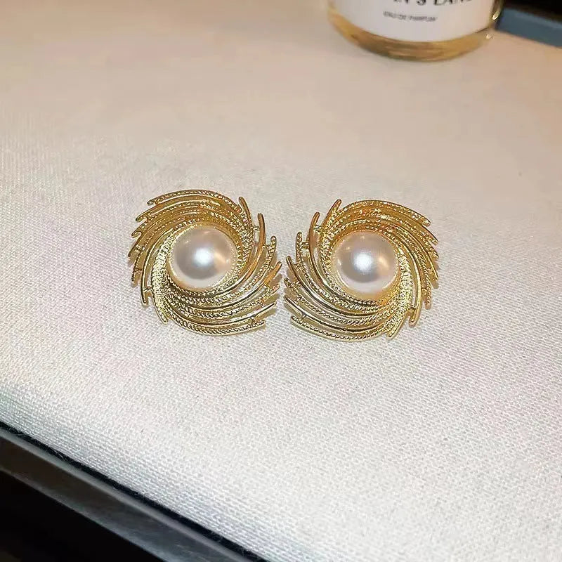 Women's vintage pearl earrings with flower-shaped alloy design and irregular hand-finished elements