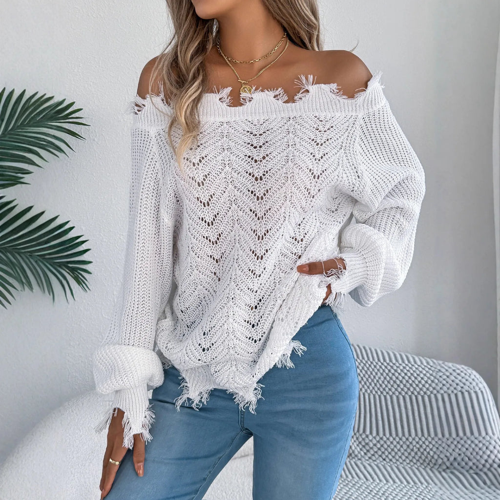 Women's white cut-off-the-shoulder long sleeve pullover sweater with hollow-out detail on front.