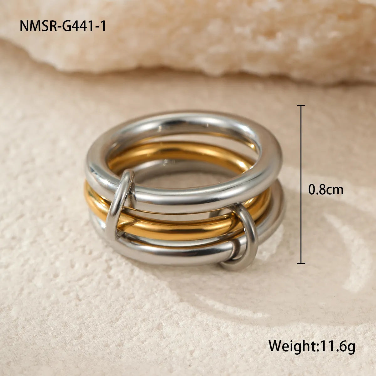 Stacked gold plated stainless steel rings with an exaggerated wide band design, shown in a free size.