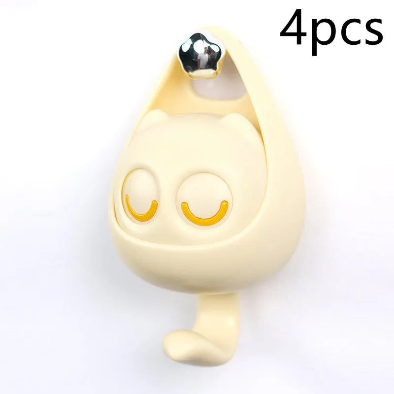 Cream white cat-shaped adhesive wall hook with winking eyes, 2.5kg capacity, 105x61x45mm