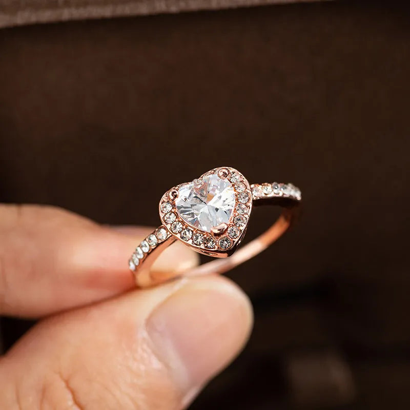 Women's heart-shaped wedding ring with crystal accents in rose gold or silvery finish