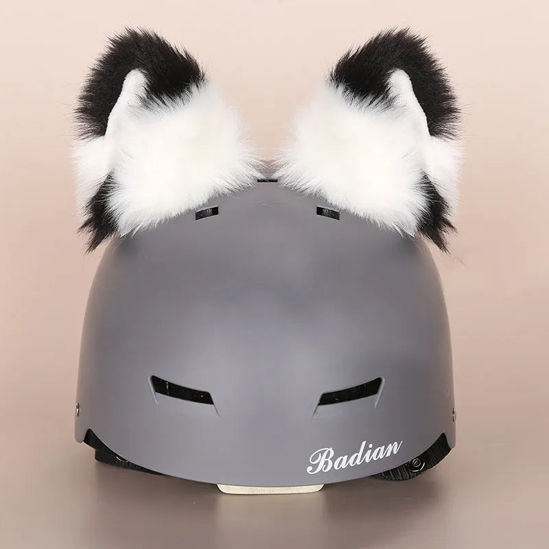 Colourful plush cartoon hat decoration sitting on top of a ski helmet