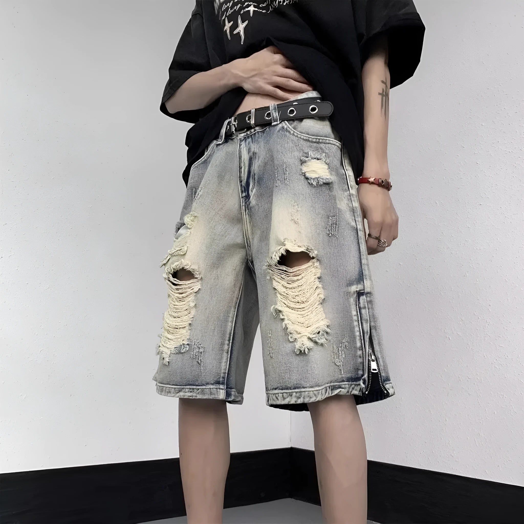 Blue retro style wide leg denim shorts with tattered detailing and loose fit