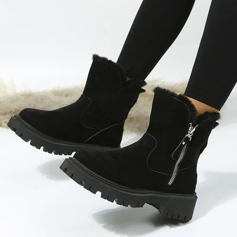 Women's black thick plush snow boots with side zipper and faux suede upper on a non-slip rubber sole.