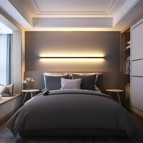 Black minimalist bedside wall lamp in 40cm to 200cm lengths with three light colour options on a wall
