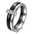 Steel black zirconium ceramic women's ring with 6mm wide band and glossy round inlay detail on a finger.