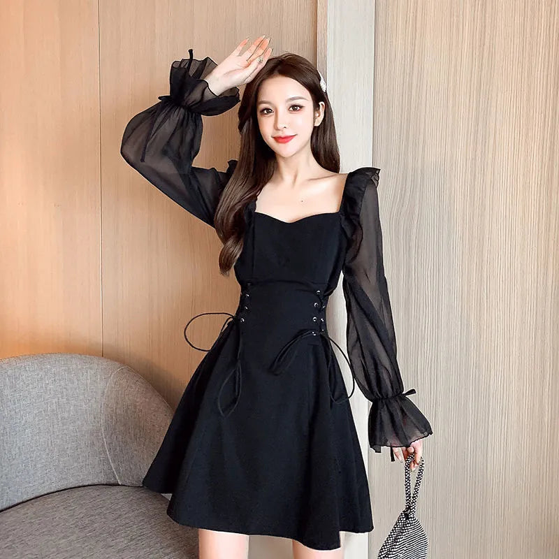 White waist-slimming chiffon patchwork dress with long sleeves on a woman.