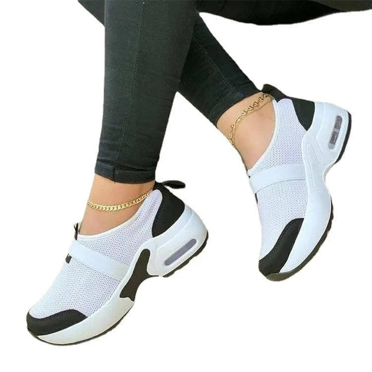 Women's lightweight mesh flat sneakers in multiple colours with a round toe and rubber sole.