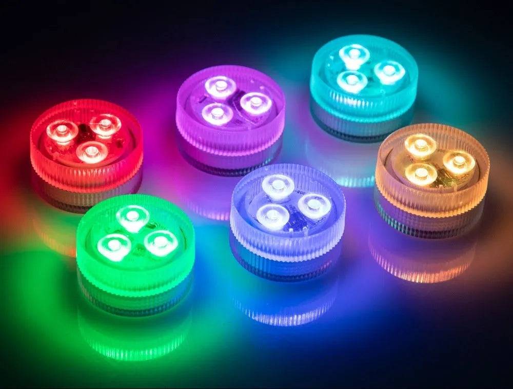 Compact white submersible aquarium LED light with remote control on a blue background