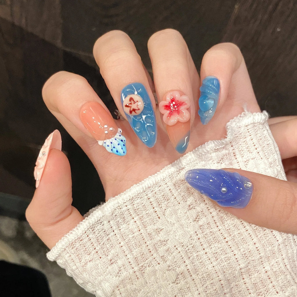 Three-dimensional carved jellyfish design plastic armour set in almond nail colour with marine styling
