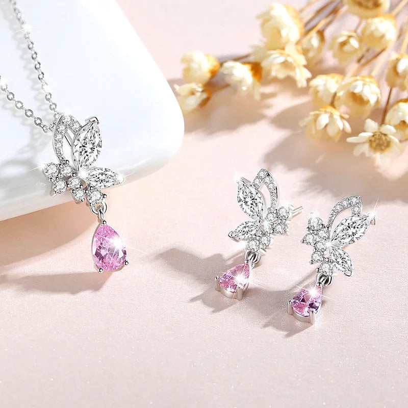 Silver stud earrings with butterfly shape and crystal accents in colour E0141