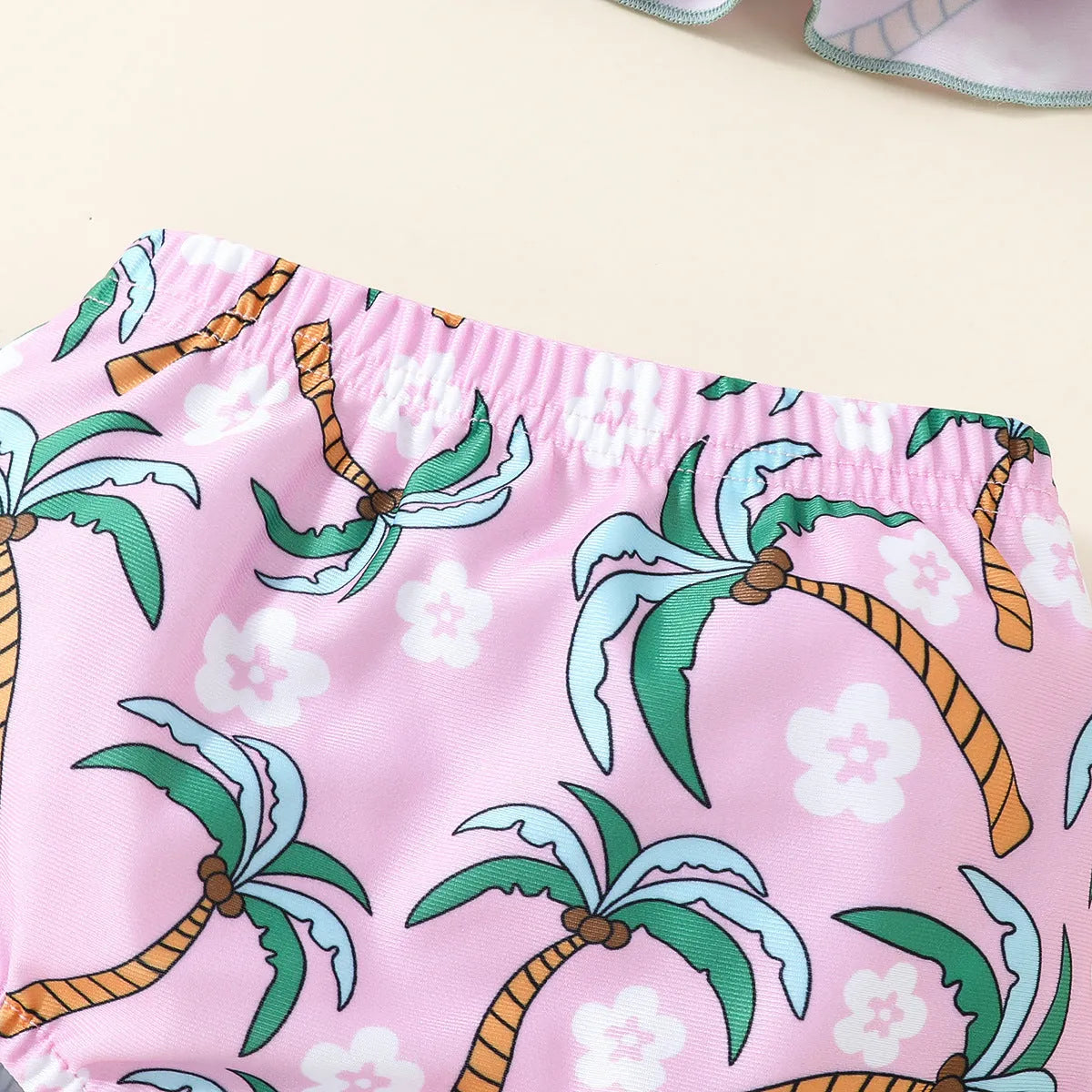 Girls' white two-piece swimsuit set with a top and shorts, made from polyester.
