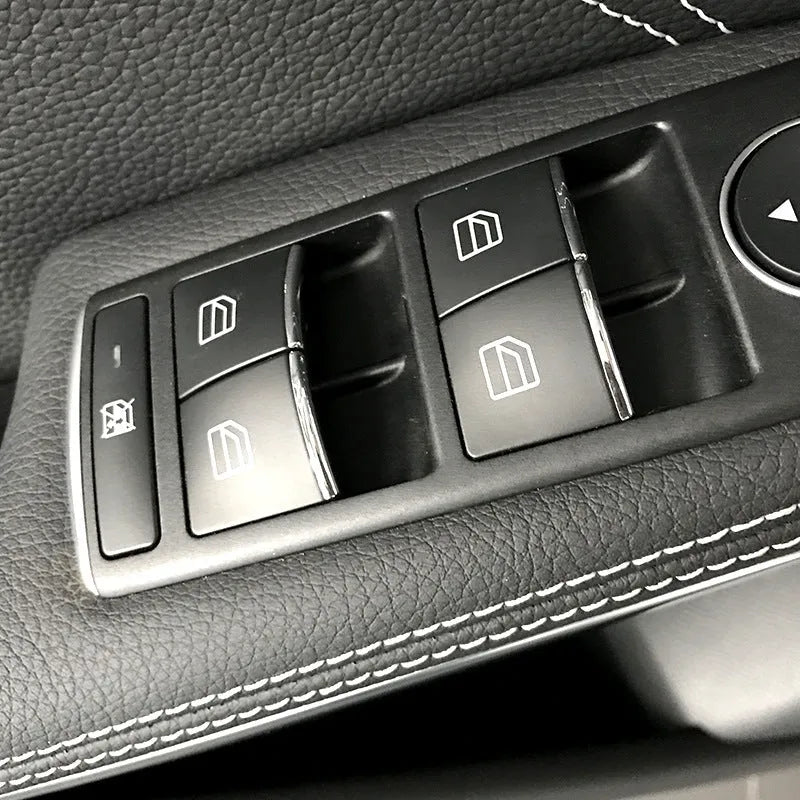Black glitter decorative sticker for a car window lift button on a white background.