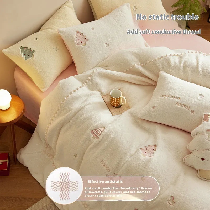 Winter milk fibre bedding four-piece set with green Christmas tree pattern on a bed.