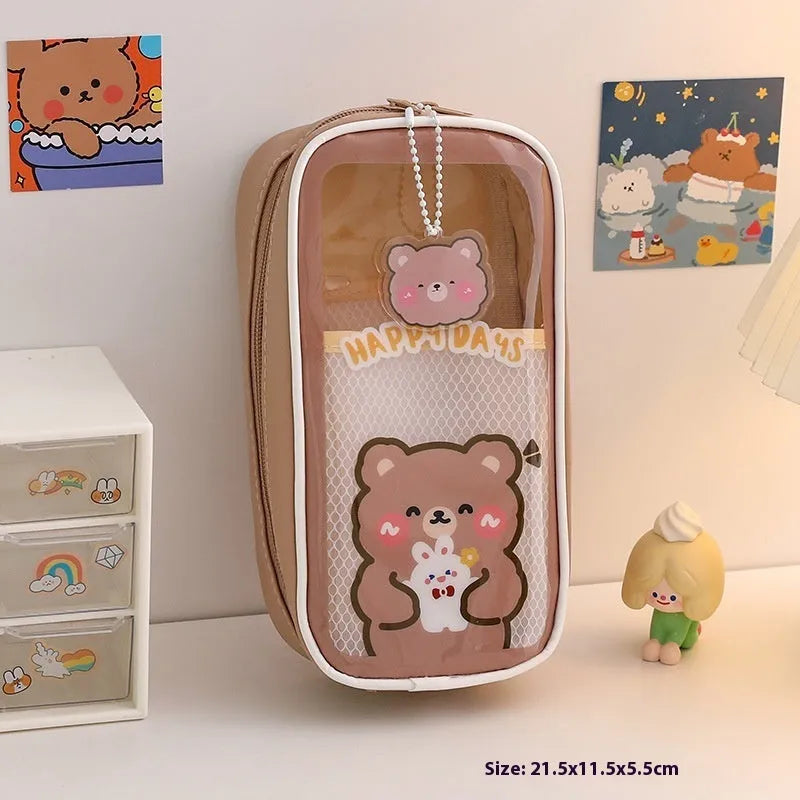 Transparent PVC pencil case with large capacity, featuring a cute Korean-style cartoon bear design.