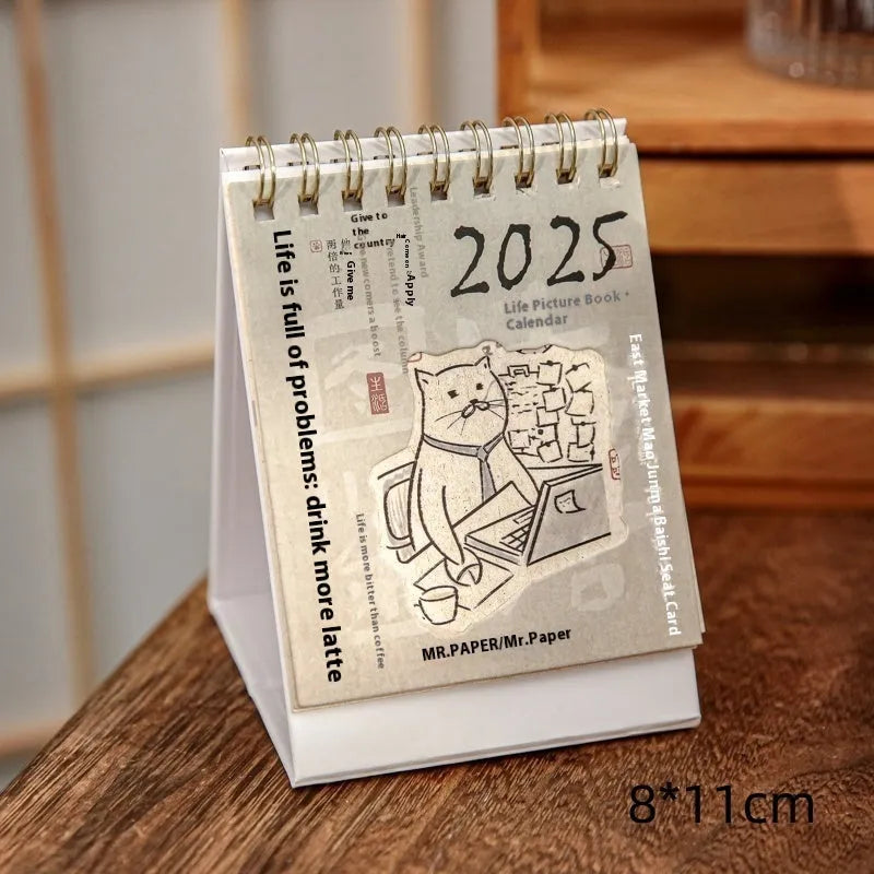Mini coffee desk calendar 2025 with four design options on small desk surface