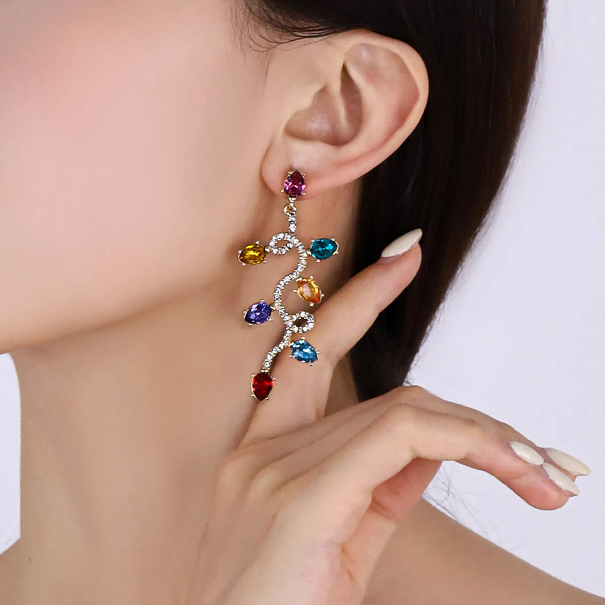 Retro fashion small lantern zircon stud earrings in colourful alloy on white background