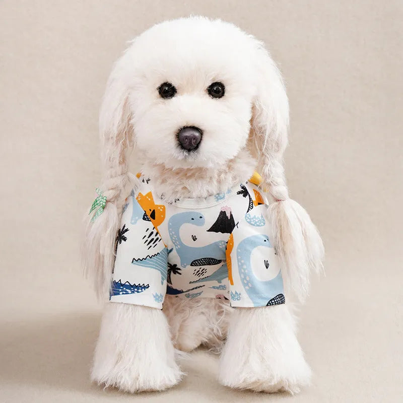 Colourful printed T-shirt on a small dog, showing the casual fit and full graphic design.