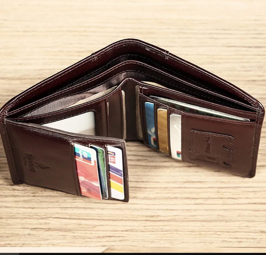 Open view of a black men's leather bifold wallet showing card slots, photo window, and zipped coin pocket.