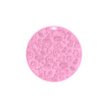 Round grey silicone pet lick mat with suction base on a kitchen floor