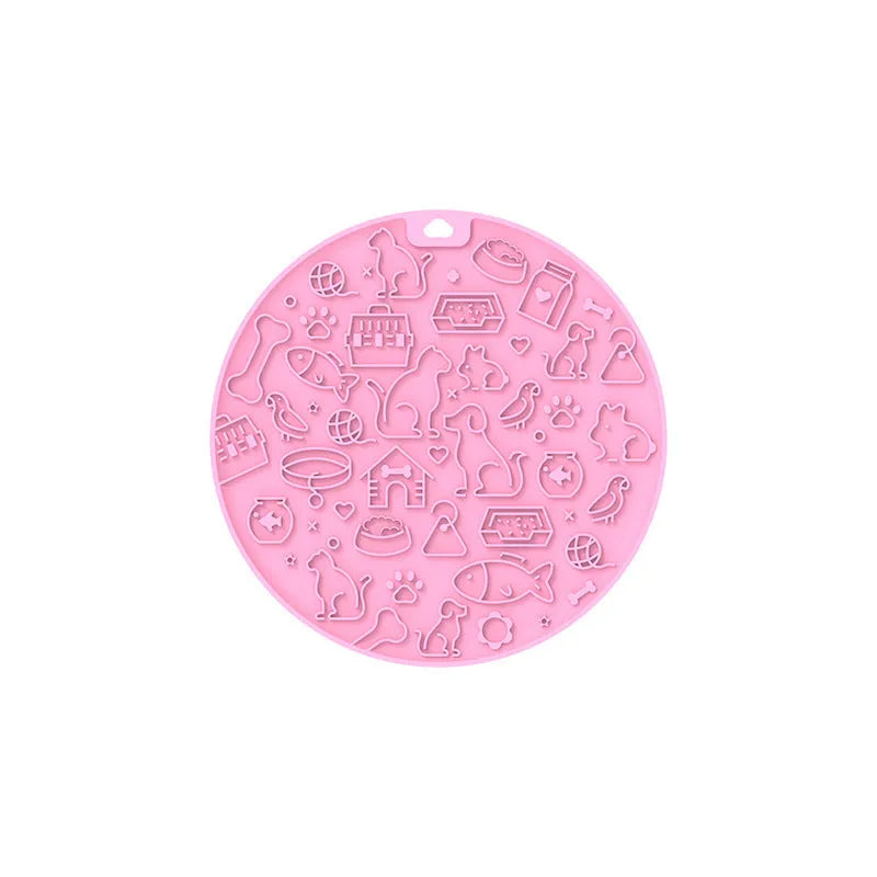 Round grey silicone pet lick mat with suction base on a kitchen floor