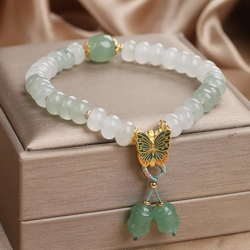 Green jade bracelet with abacus beads and electroplated butterfly tassel decoration