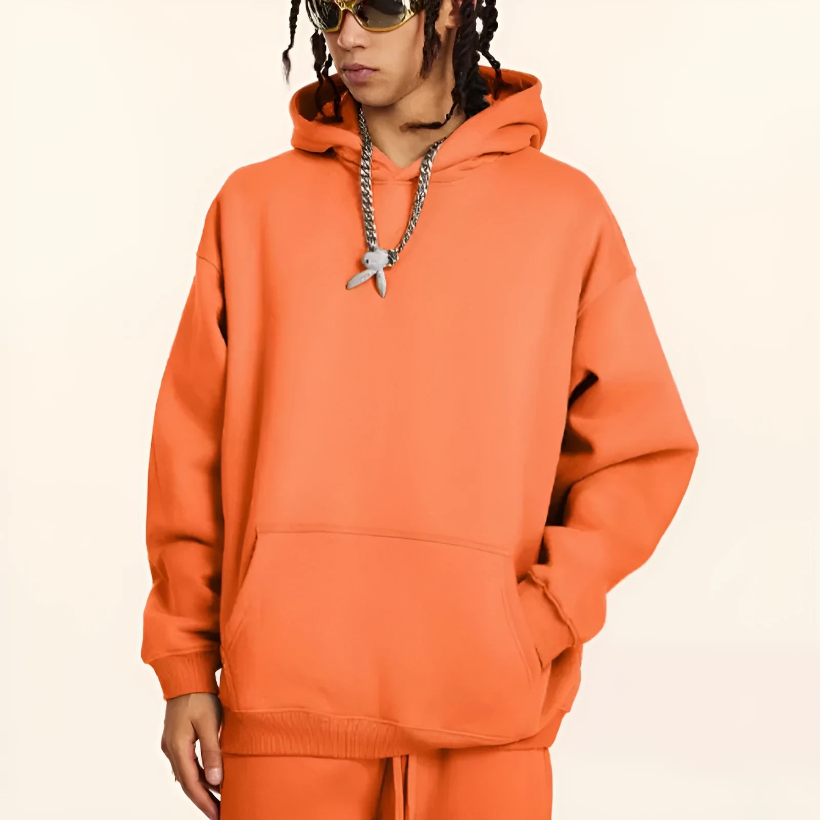 Men's loose-fit cotton hooded sweater in grey, showing drop-shoulder sleeve detail.