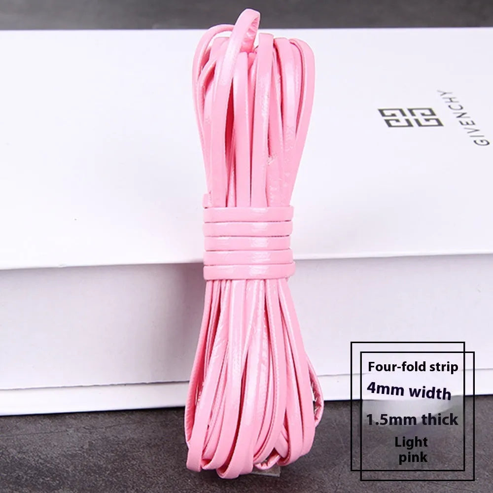 Coils of woven PU leather craft cord in various colours including black, brown, blue, red, and gold.