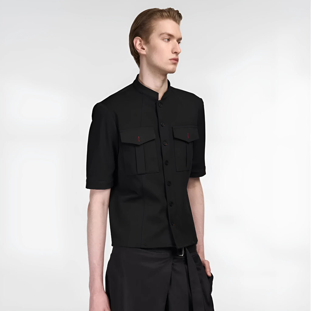 Handmade black half-sleeve hunting shirt with a shirt collar on a hanger.