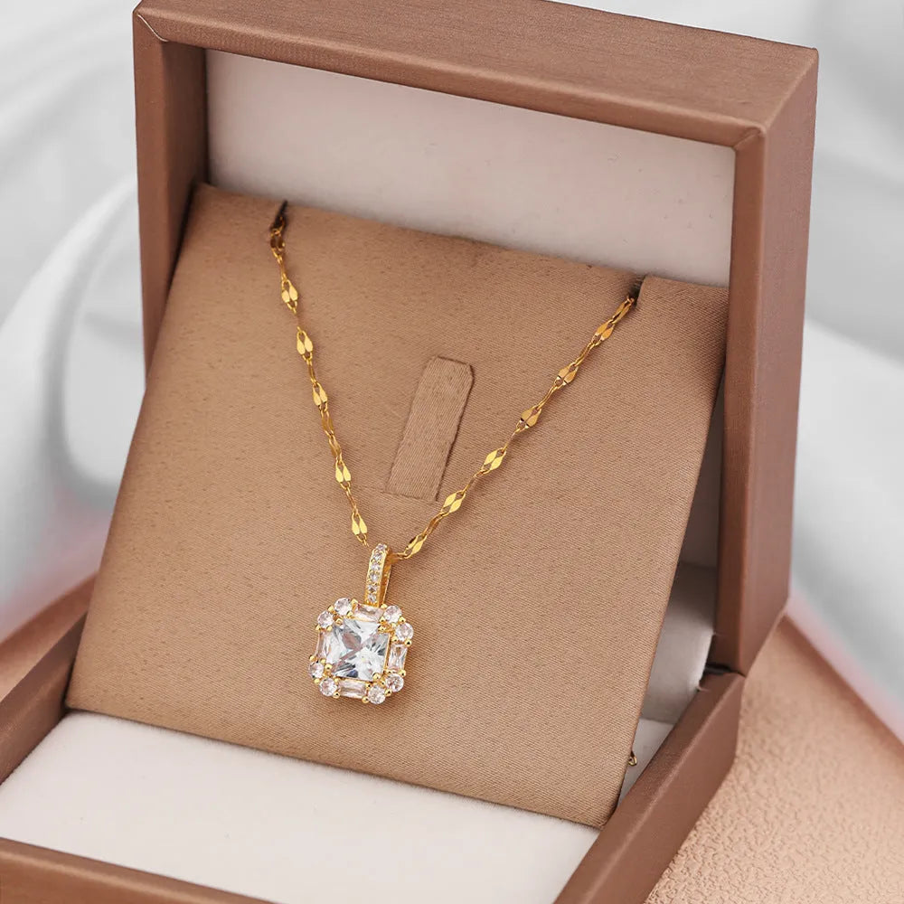 Gold geometric quadrilateral pendant with mixed gem inlays on titanium steel water wave chain necklace
