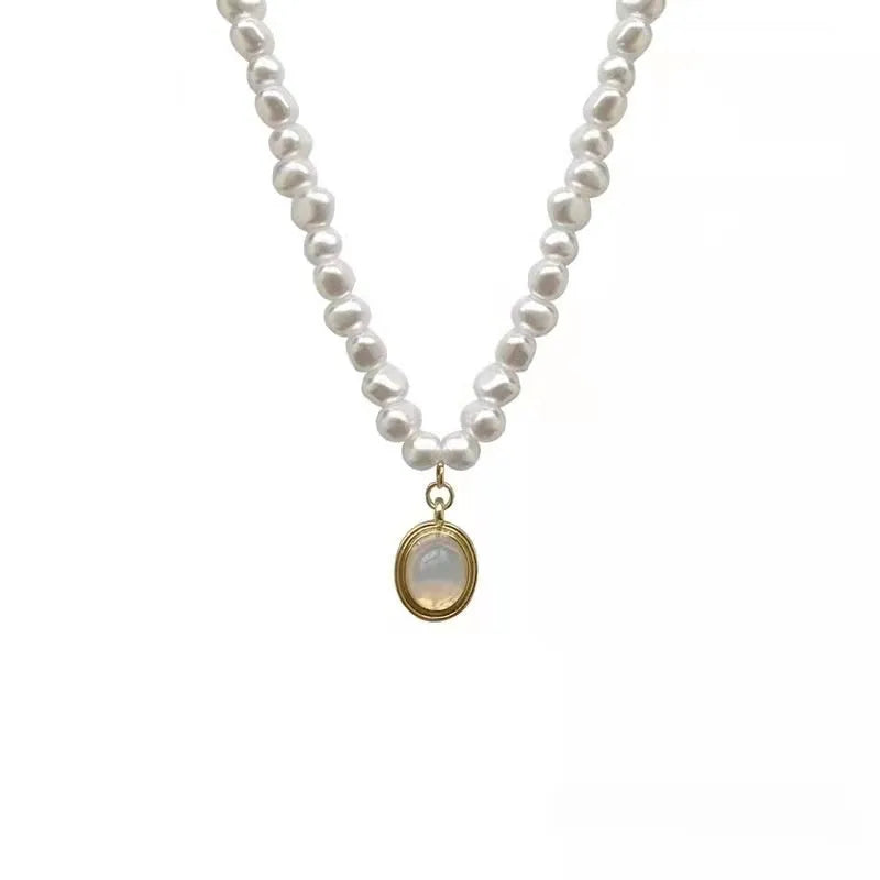 French Court style vintage pearl necklace with geometric alloy pendant on an adjustable chain.