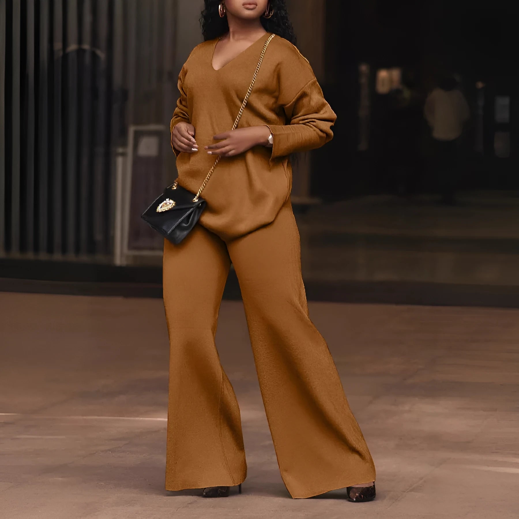 Women's brown thickened suede two-piece suit with split sleeves and trousers in casual style.