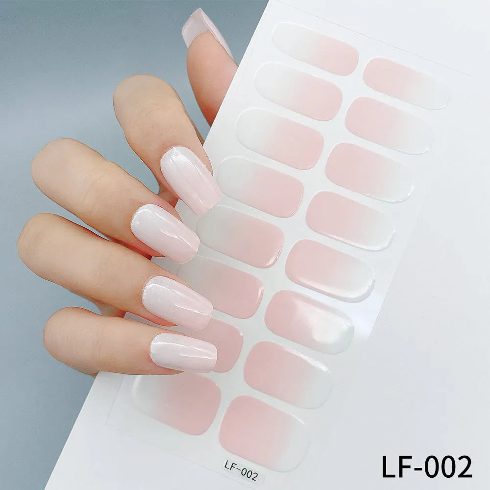16 solid colour full nail art stickers with 22 patterns including cross, rose, butterfly designs in 12x6mm oval size
