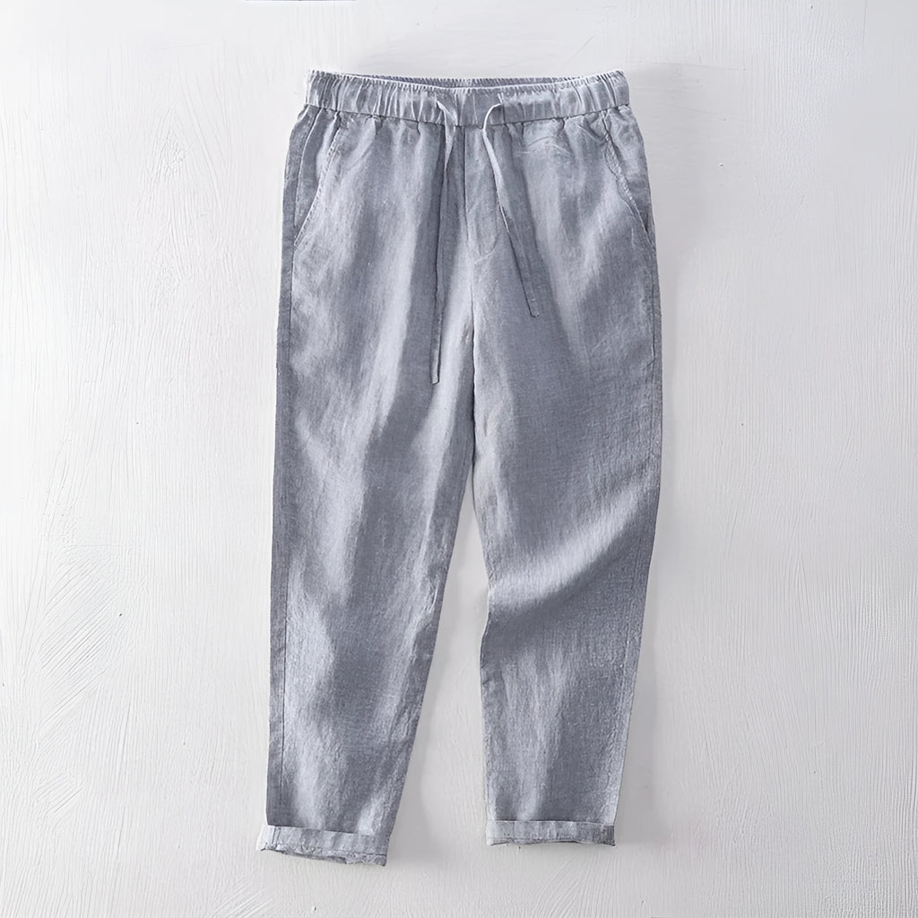 Men's straight-leg linen trousers in a mid waist cut, shown in a neutral colour.