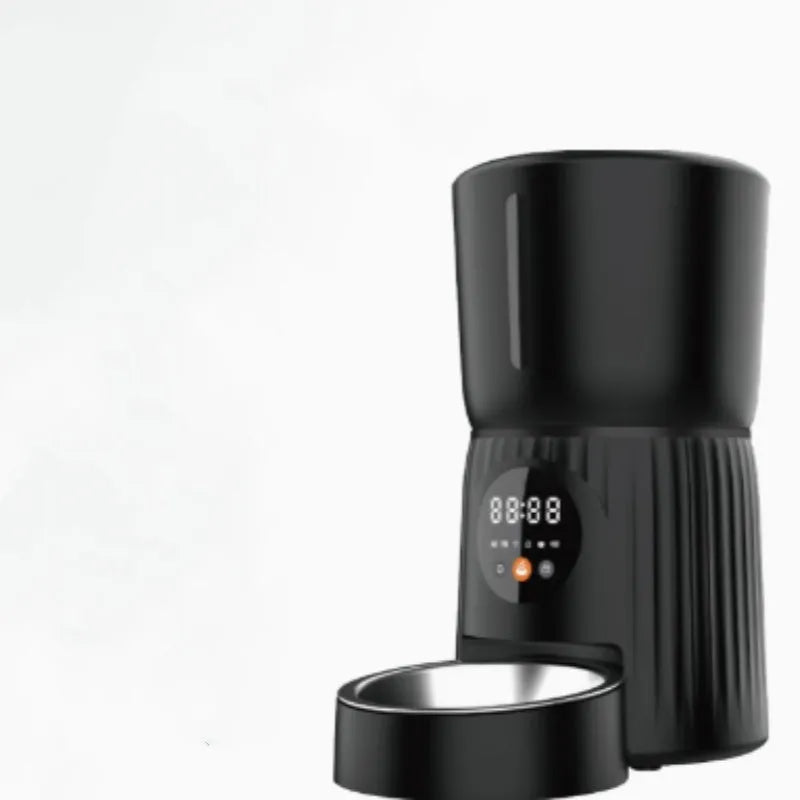 Black automatic pet feeder with digital timer display and food hopper.