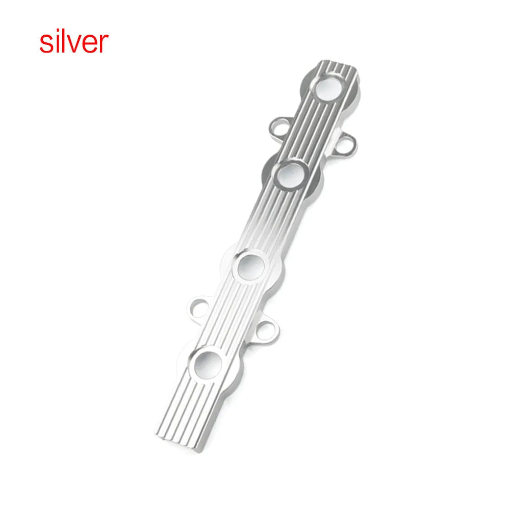 Aluminium engine harness housing bracket in blue, red, and silver, showing variants with and without mounting holes.